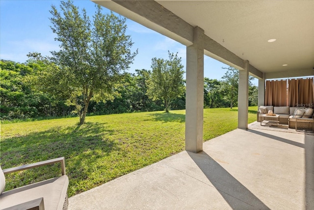 2340 Standing Rock Cir, Oakland, FL 34787 - view of grassy yard with a patio, an outdoor hangout area, and view of wooded area