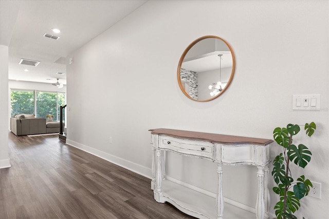 2340 Standing Rock Cir, Oakland, FL 34787 - hallway with dark wood-type flooring, a chandelier, baseboards, and recessed lighting