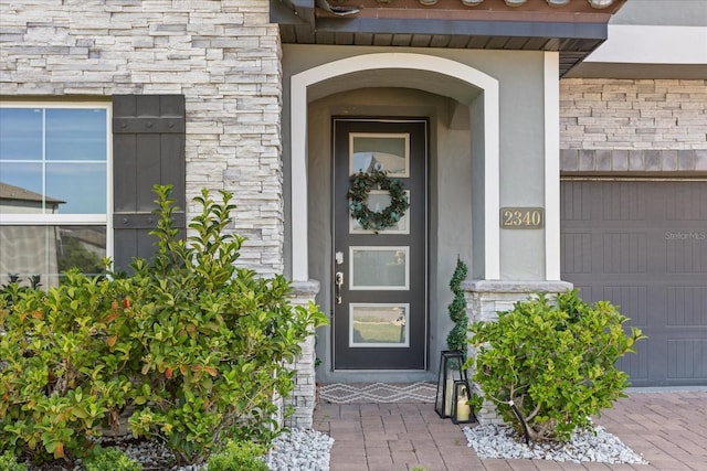 2340 Standing Rock Cir, Oakland, FL 34787 - entrance to property featuring stone siding and stucco siding