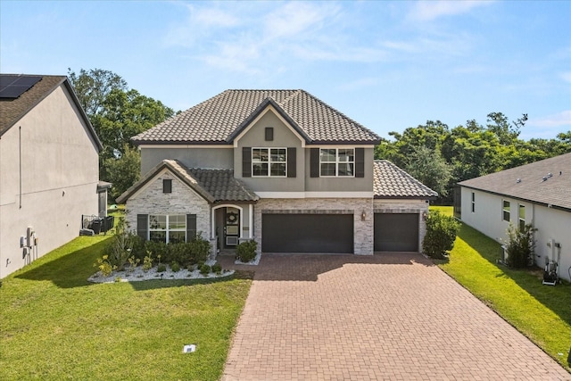 2340 Standing Rock Cir, Oakland, FL 34787 - view of front of property featuring a tiled roof, decorative driveway, stucco siding, and a front lawn
