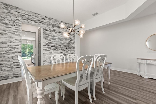 2340 Standing Rock Cir, Oakland, FL 34787 - dining space featuring a chandelier, wood finished floors, and baseboards