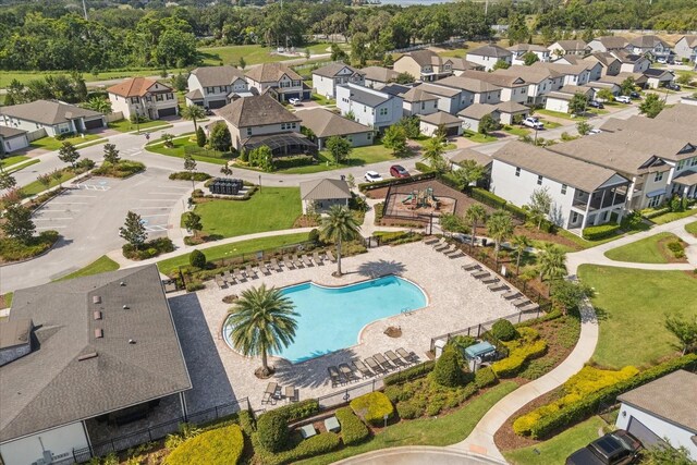2340 Standing Rock Cir, Oakland, FL 34787 - aerial perspective of suburban area featuring a pool