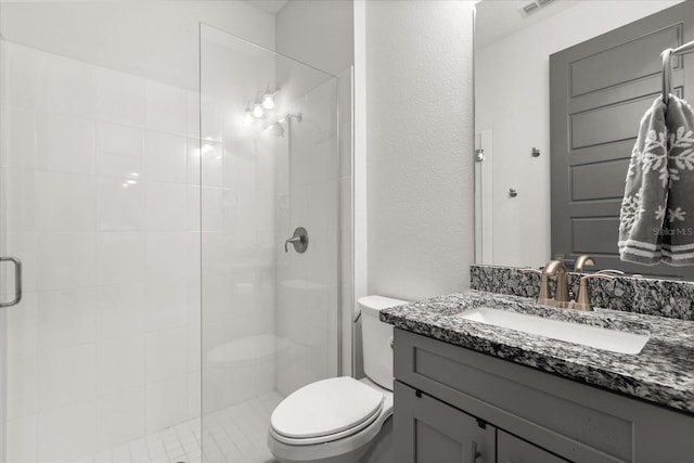 2340 Standing Rock Cir, Oakland, FL 34787 - bathroom featuring toilet, a shower stall, vanity, and a textured wall