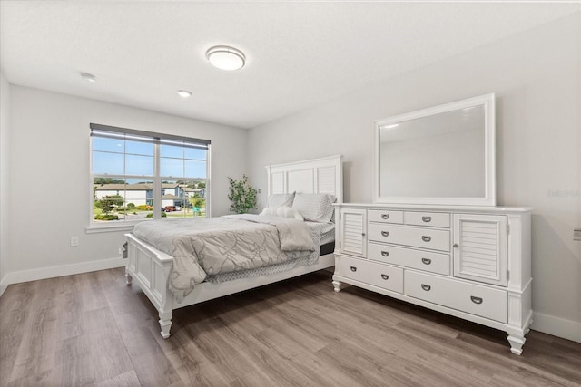 2340 Standing Rock Cir, Oakland, FL 34787 - bedroom with light wood finished floors and baseboards