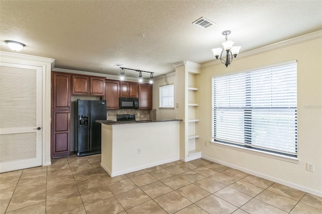 909 Charo Pkwy Unit 1011, Davenport, FL 33897 - kitchen featuring black appliances, a peninsula, dark countertops, a chandelier, and a textured ceiling