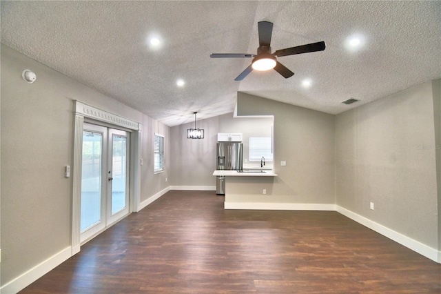 7504 Willow Wisp Dr E, Lakeland, FL 33810 - unfurnished living room featuring a textured ceiling, dark wood-type flooring, a ceiling fan, recessed lighting, and baseboards