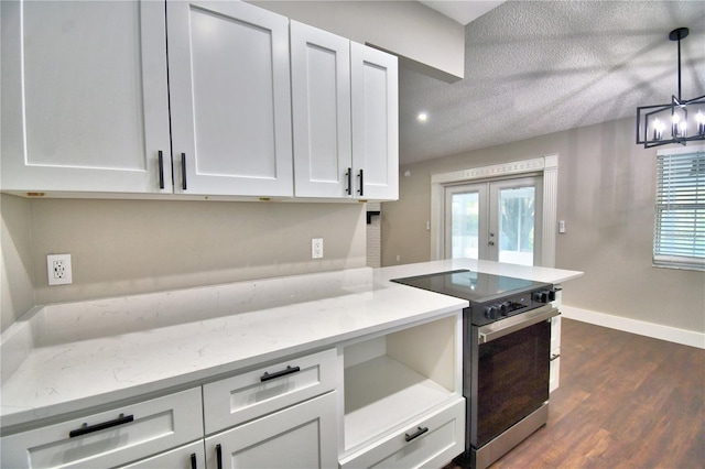 7504 Willow Wisp Dr E, Lakeland, FL 33810 - kitchen with stainless steel electric range oven, french doors, white cabinetry, baseboards, and dark wood finished floors