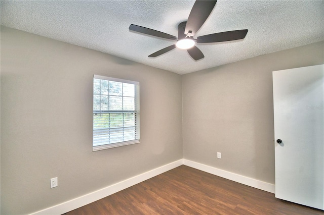 7504 Willow Wisp Dr E, Lakeland, FL 33810 - spare room featuring a textured ceiling, dark wood-style floors, baseboards, and ceiling fan