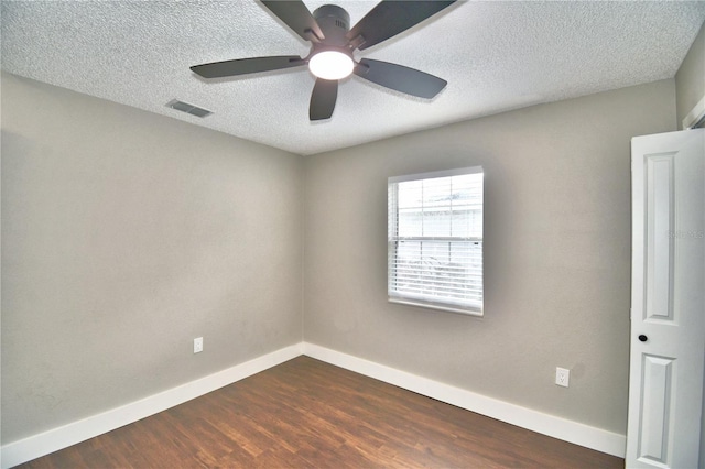 7504 Willow Wisp Dr E, Lakeland, FL 33810 - unfurnished room with baseboards, dark wood-type flooring, a textured ceiling, and ceiling fan