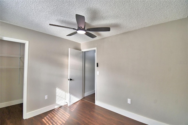 7504 Willow Wisp Dr E, Lakeland, FL 33810 - unfurnished bedroom with wood finished floors, baseboards, a textured ceiling, a ceiling fan, and a closet