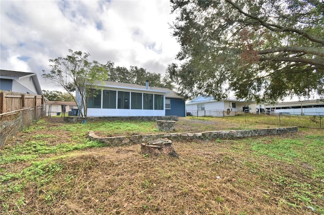 7504 Willow Wisp Dr E, Lakeland, FL 33810 - back of property with a sunroom
