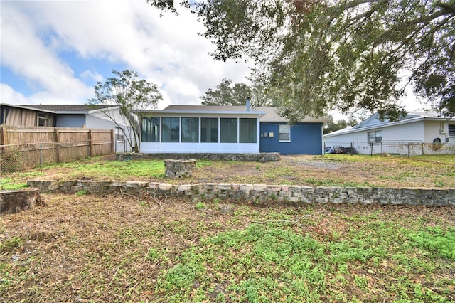 7504 Willow Wisp Dr E, Lakeland, FL 33810 - rear view of property featuring a sunroom