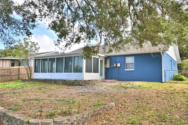 7504 Willow Wisp Dr E, Lakeland, FL 33810 - back of house featuring a sunroom
