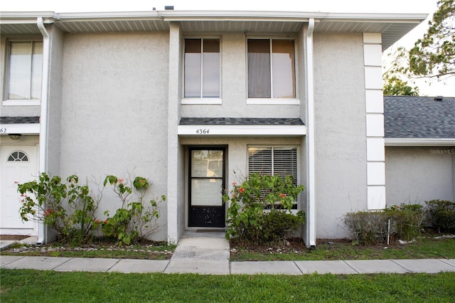 4364 White Pine Ave Unit 3, Orlando, FL 32811 - view of front of house with stucco siding and a shingled roof