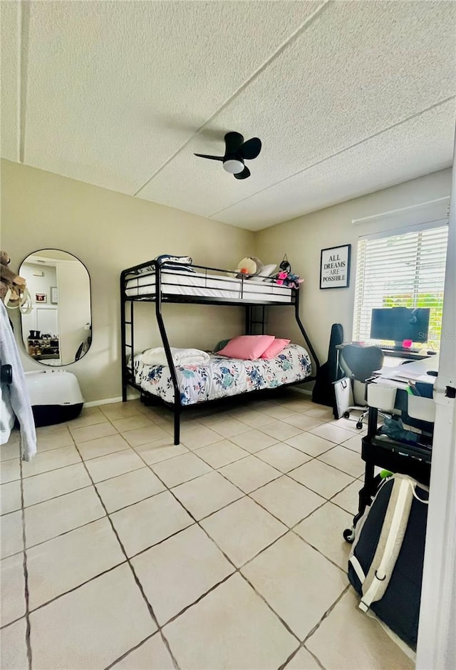 4364 White Pine Ave Unit 3, Orlando, FL 32811 - bedroom featuring light tile patterned floors, a textured ceiling, and a ceiling fan