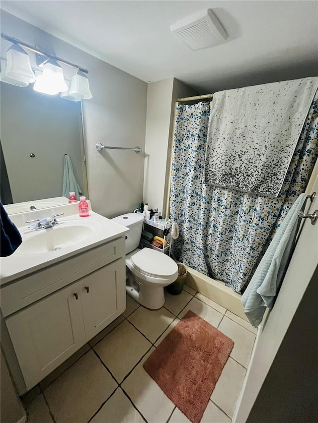 4364 White Pine Ave Unit 3, Orlando, FL 32811 - bathroom featuring toilet, vanity, tile patterned flooring, and shower / bath combo with shower curtain