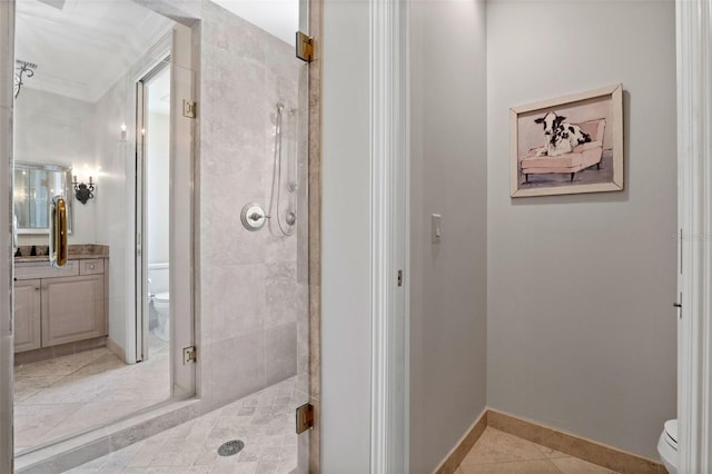 140 E Morse Blvd Unit J, Winter Park, FL 32789 - bathroom featuring toilet, tile patterned flooring, vanity, a stall shower, and ornamental molding