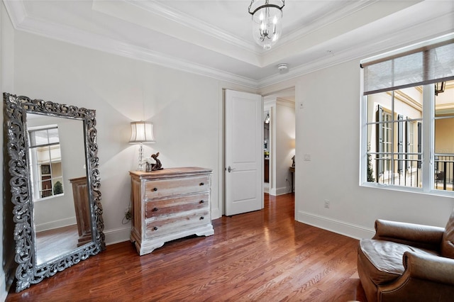 140 E Morse Blvd Unit J, Winter Park, FL 32789 - sitting room featuring wood finished floors, ornamental molding, a raised ceiling, and baseboards