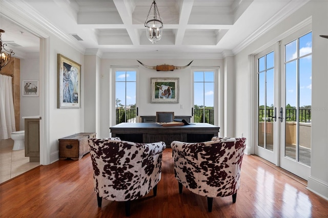 140 E Morse Blvd Unit J, Winter Park, FL 32789 - dining space with a chandelier, healthy amount of natural light, a desk, wood finished floors, and beamed ceiling