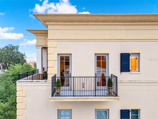 140 E Morse Blvd Unit J, Winter Park, FL 32789 - view of property exterior featuring a balcony and stucco siding
