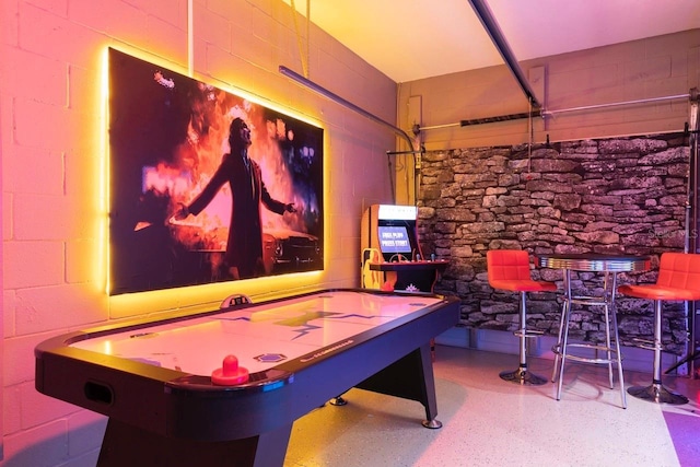 3004 Protagonist St, Kissimmee, FL 34746 - game room with concrete block wall and speckled floor