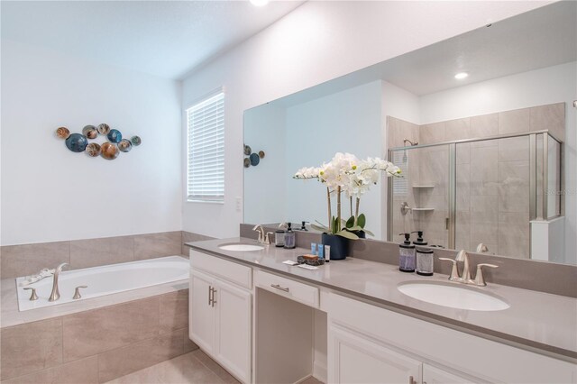 3004 Protagonist St, Kissimmee, FL 34746 - bathroom featuring double vanity, a stall shower, a bath, and tile patterned flooring