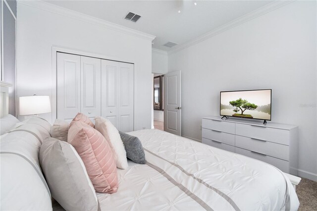 3004 Protagonist St, Kissimmee, FL 34746 - carpeted bedroom with a closet, ornamental molding, and baseboards
