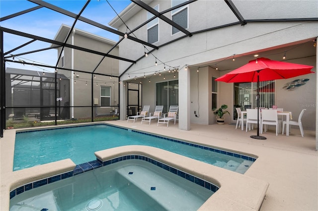 3004 Protagonist St, Kissimmee, FL 34746 - view of pool with a patio area, a pool with connected hot tub, and glass enclosure