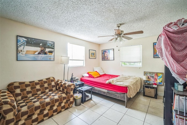 1711 E Sewaha St, Tampa, FL 33612 - bedroom with light tile patterned floors, ceiling fan, and a textured ceiling