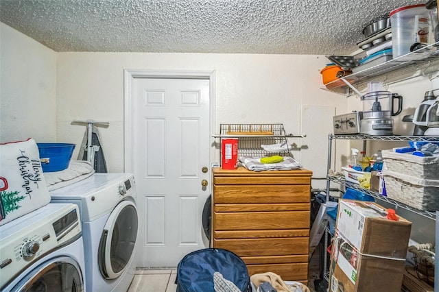 1711 E Sewaha St, Tampa, FL 33612 - washroom featuring independent washer and dryer, a textured ceiling, and light tile patterned floors