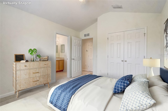 4178 SW 43rd Cir, Ocala, FL 34474 - bedroom featuring vaulted ceiling, a closet, light colored carpet, connected bathroom, and baseboards