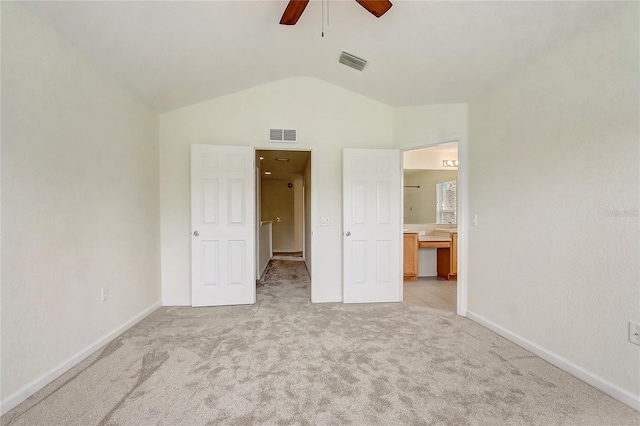 4178 SW 43rd Cir, Ocala, FL 34474 - unfurnished bedroom with carpet flooring, lofted ceiling, baseboards, connected bathroom, and a ceiling fan