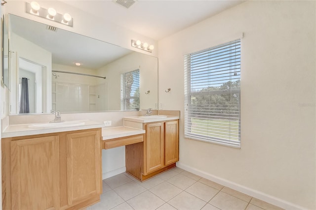 4178 SW 43rd Cir, Ocala, FL 34474 - bathroom with tile patterned flooring, double vanity, a shower, and baseboards