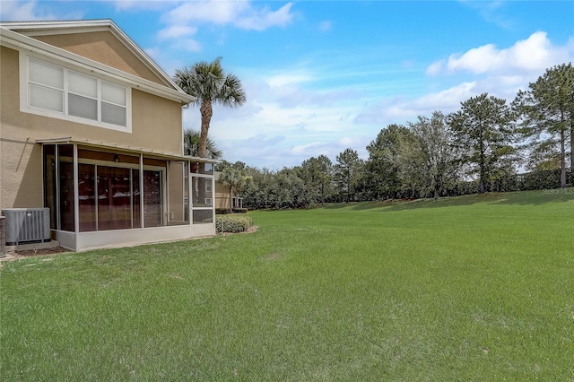 4178 SW 43rd Cir, Ocala, FL 34474 - view of green lawn with central air condition unit and a sunroom