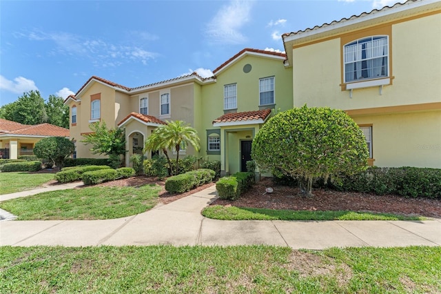 214 Monroe Cir, Davenport, FL 33896 - view of front of house with a tile roof and stucco siding