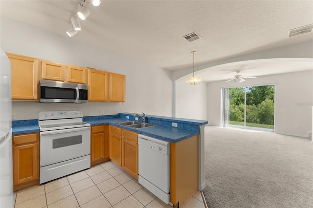 214 Monroe Cir, Davenport, FL 33896 - kitchen with white appliances, a sink, a peninsula, open floor plan, and a ceiling fan