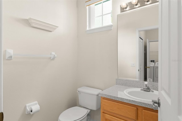 214 Monroe Cir, Davenport, FL 33896 - half bath with washer and dryer, toilet, and vanity