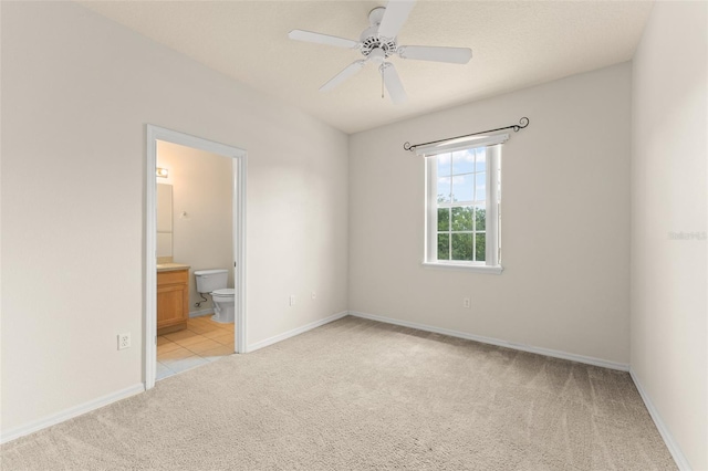 214 Monroe Cir, Davenport, FL 33896 - spare room with light colored carpet, ceiling fan, and baseboards