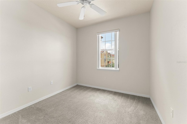 214 Monroe Cir, Davenport, FL 33896 - spare room with carpet flooring, baseboards, and a ceiling fan