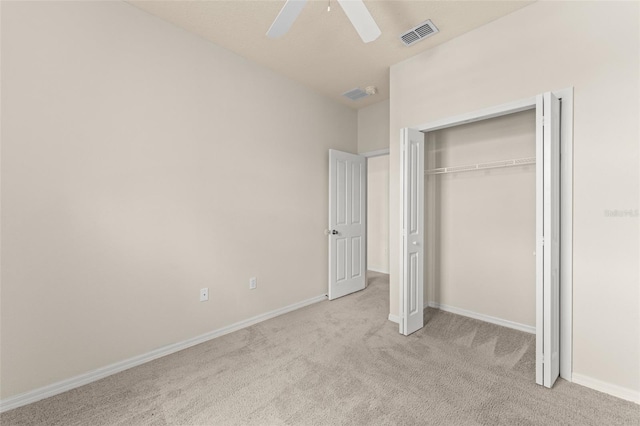 214 Monroe Cir, Davenport, FL 33896 - unfurnished bedroom with carpet flooring, baseboards, ceiling fan, and a closet