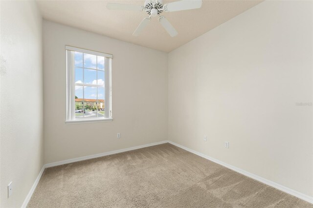 214 Monroe Cir, Davenport, FL 33896 - carpeted spare room featuring baseboards and a ceiling fan