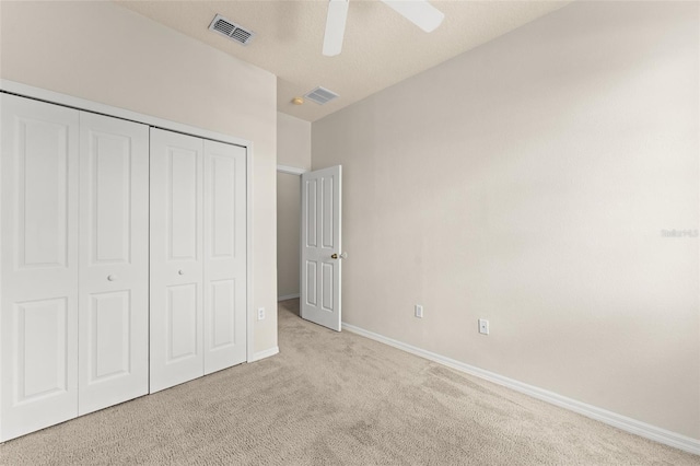 214 Monroe Cir, Davenport, FL 33896 - unfurnished bedroom featuring carpet flooring, baseboards, a closet, and ceiling fan