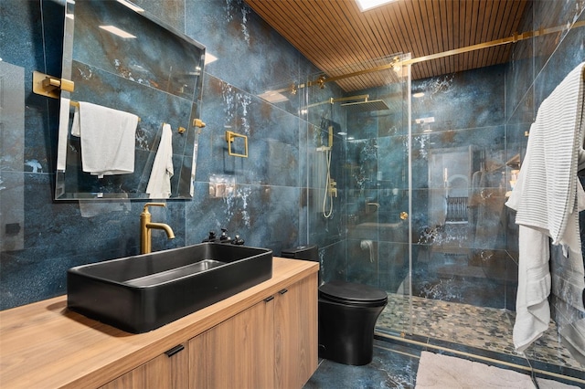 8131 Vineland Oaks Blvd, Orlando, FL 32835 - bathroom featuring tile walls, a walk in shower, vanity, and toilet