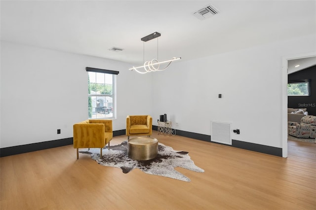 8131 Vineland Oaks Blvd, Orlando, FL 32835 - living area with wood finished floors and baseboards
