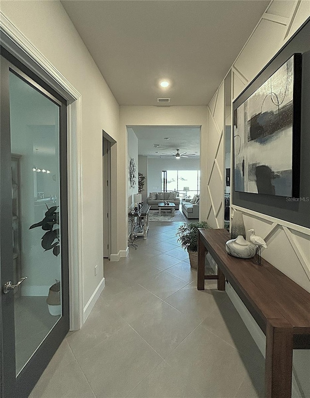 410 SE Vallarta Dr, Port St Lucie, FL 34984 - corridor featuring light tile patterned flooring, recessed lighting, and baseboards