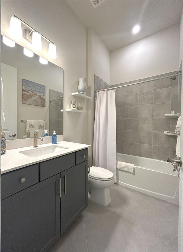 410 SE Vallarta Dr, Port St Lucie, FL 34984 - full bath with toilet, vanity, shower / bath combo, and tile patterned flooring