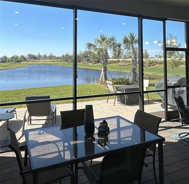 410 SE Vallarta Dr, Port St Lucie, FL 34984 - deck with outdoor dining area and a water view
