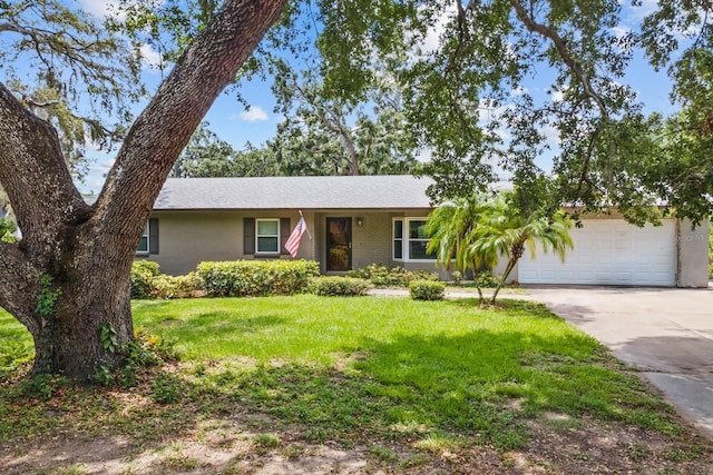 310 E Gulley Ave, Oakland, FL 34760 - ranch-style home featuring driveway, an attached garage, and a front yard