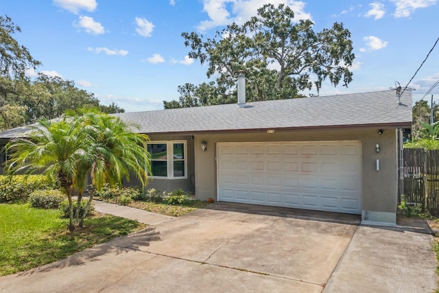 310 E Gulley Ave, Oakland, FL 34760 - view of front of property with driveway, a garage, stucco siding, and roof with shingles