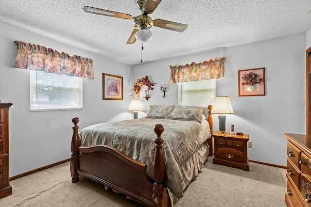 310 E Gulley Ave, Oakland, FL 34760 - bedroom with light colored carpet, baseboards, a ceiling fan, and a textured ceiling
